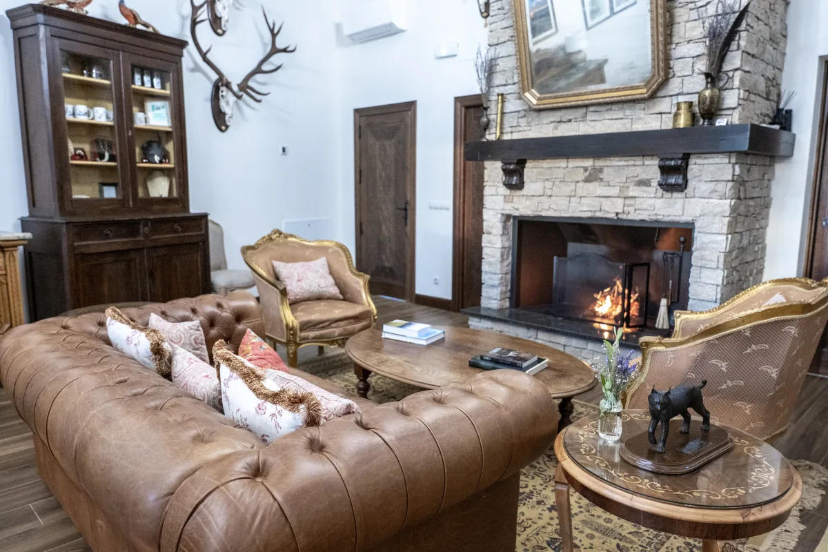 The lodge lounge fireplace and hunting trophies